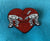 A red glitter enamel pin of two AT-AT's being tied with a rope that is in the shape of a heart. Background is aqua blue. 