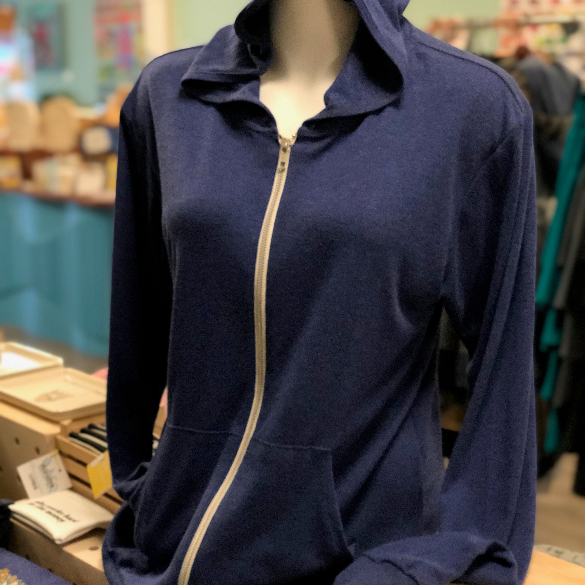 Heathered royal blue triblend unisex hooded sweatshirt. Shown from the zippered front. 