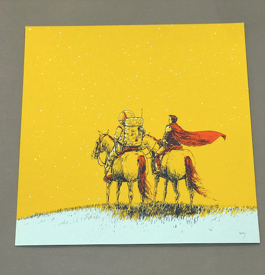 A hand pulled screenprint of a man with a red cape sitting on a horse. They are next to an astronaut also sitting on a horse. The sky is a sunny bright yellow with lots of stars. The grass is mint green. 
