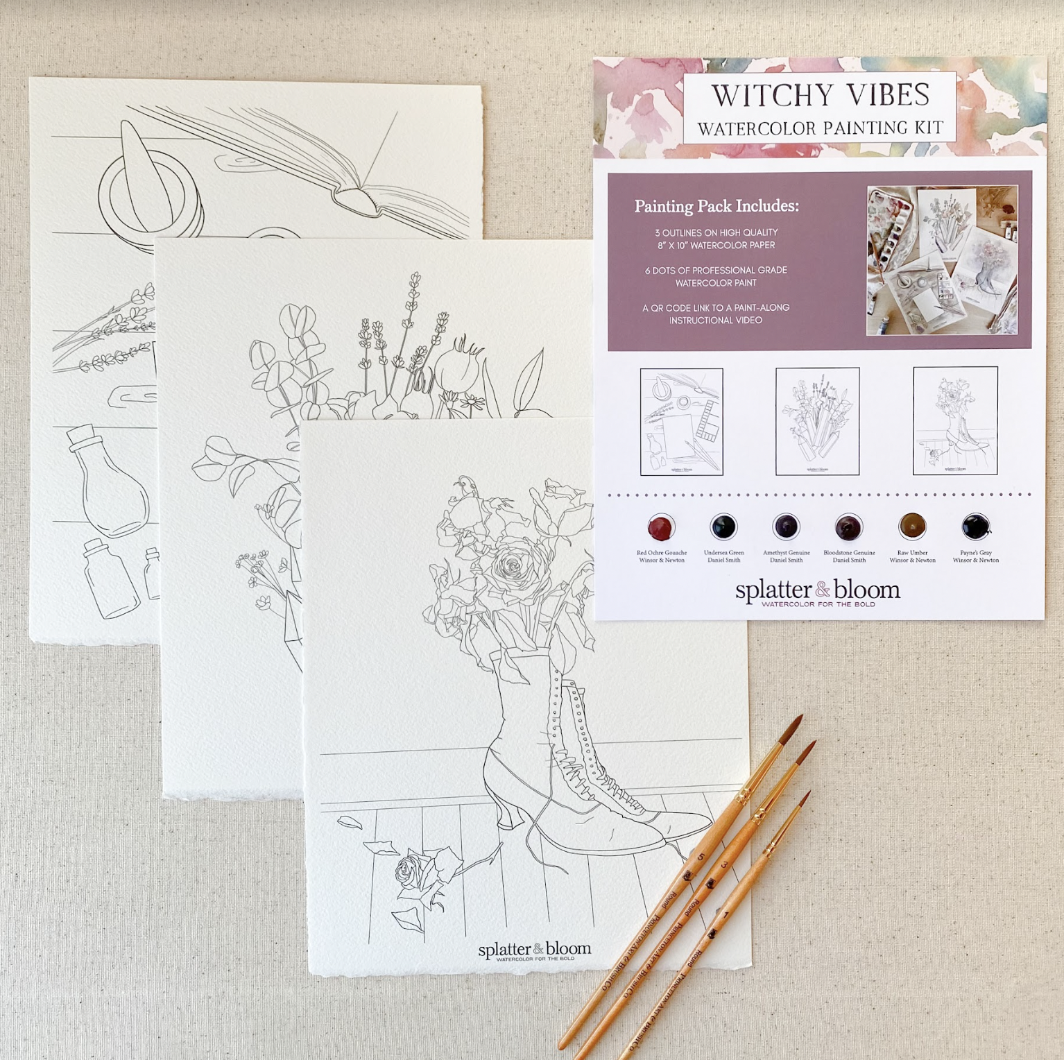 Three images printed on watercolor paper are ready to be painted. One is a witches boot with flowers growing out of it. The set is called Witchy Vibes. 